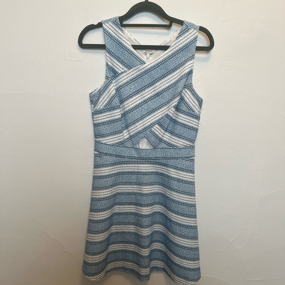 Blue and white cocktail dress with cutouts